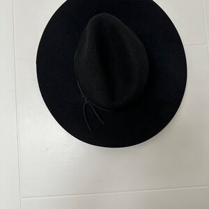 Free People presents the Phenix Classic Black Wool Hat with leather bands.